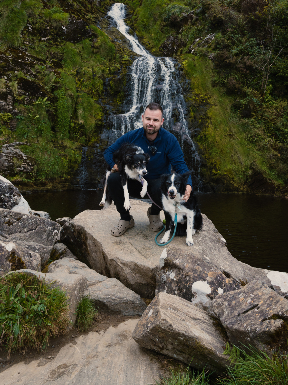 A photo of Robbie Roams, Archie & Gem at a waterfall in Ireland.