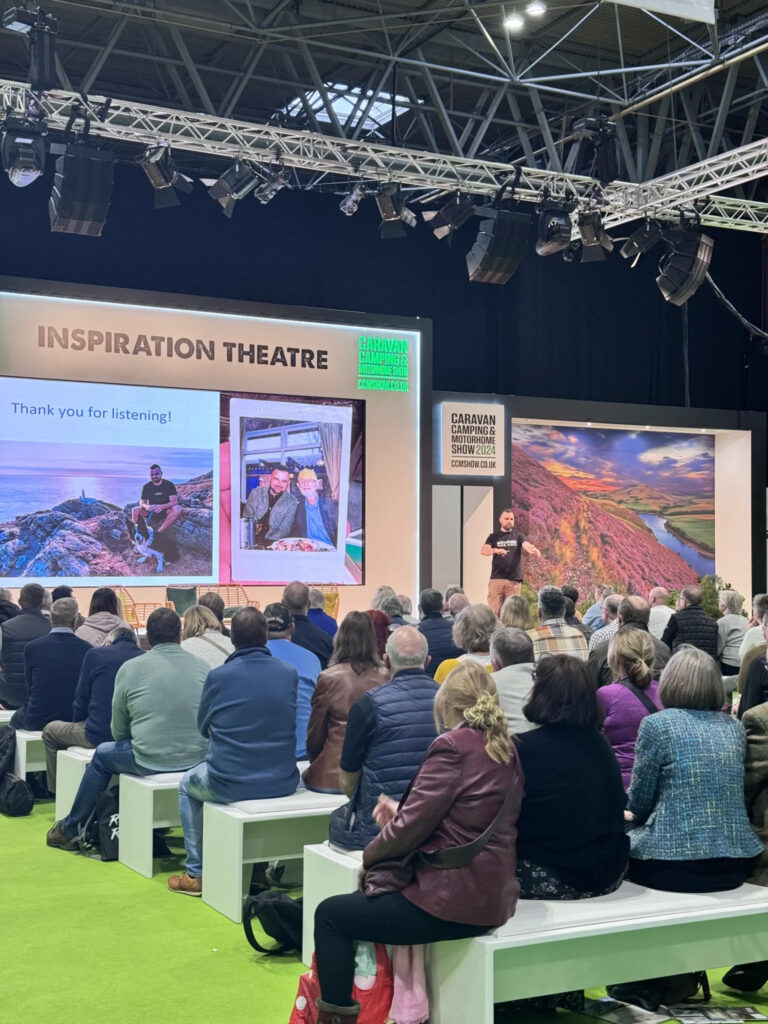 Robbie Roams gives a talk at the Caravan, Camping & Motorhome Show in 2024